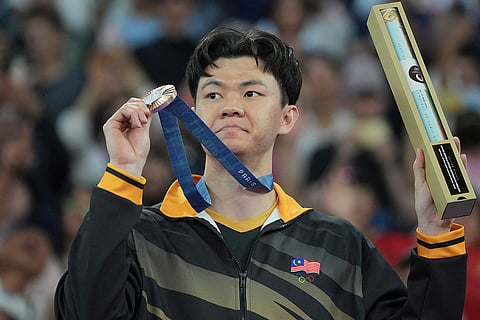 Badminton Men's singles: Malaysia's Lee Zii Jia celebrates after winning the bronze medal